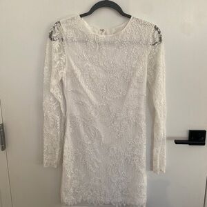 Beaded white minidress, great for bachelorette trip or other bridal activities.